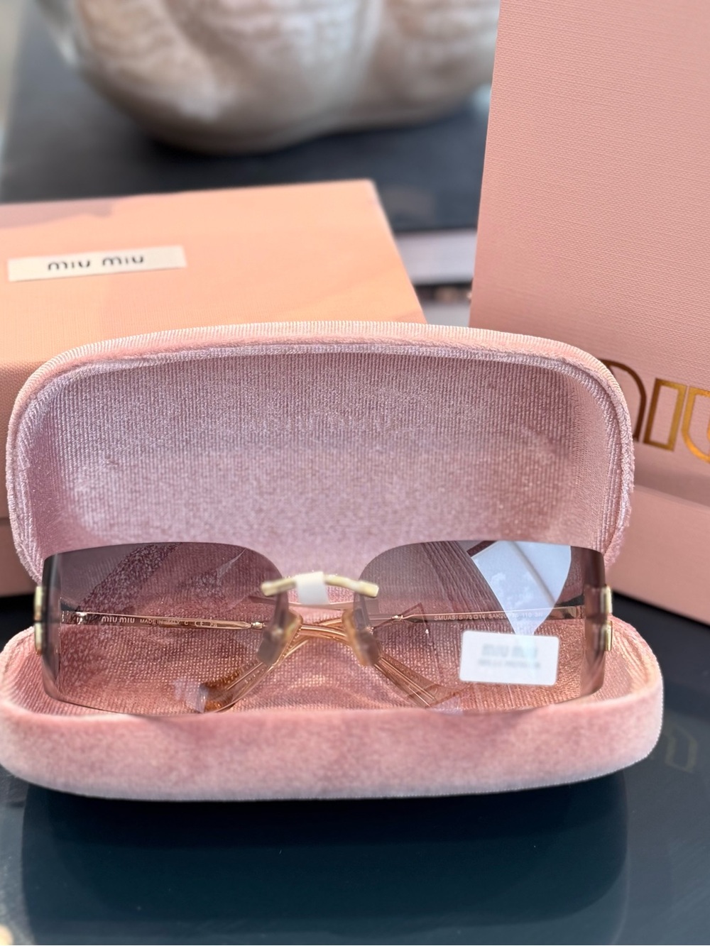 Miu Miu Pink Rimless Sunglasses with Gold Accents